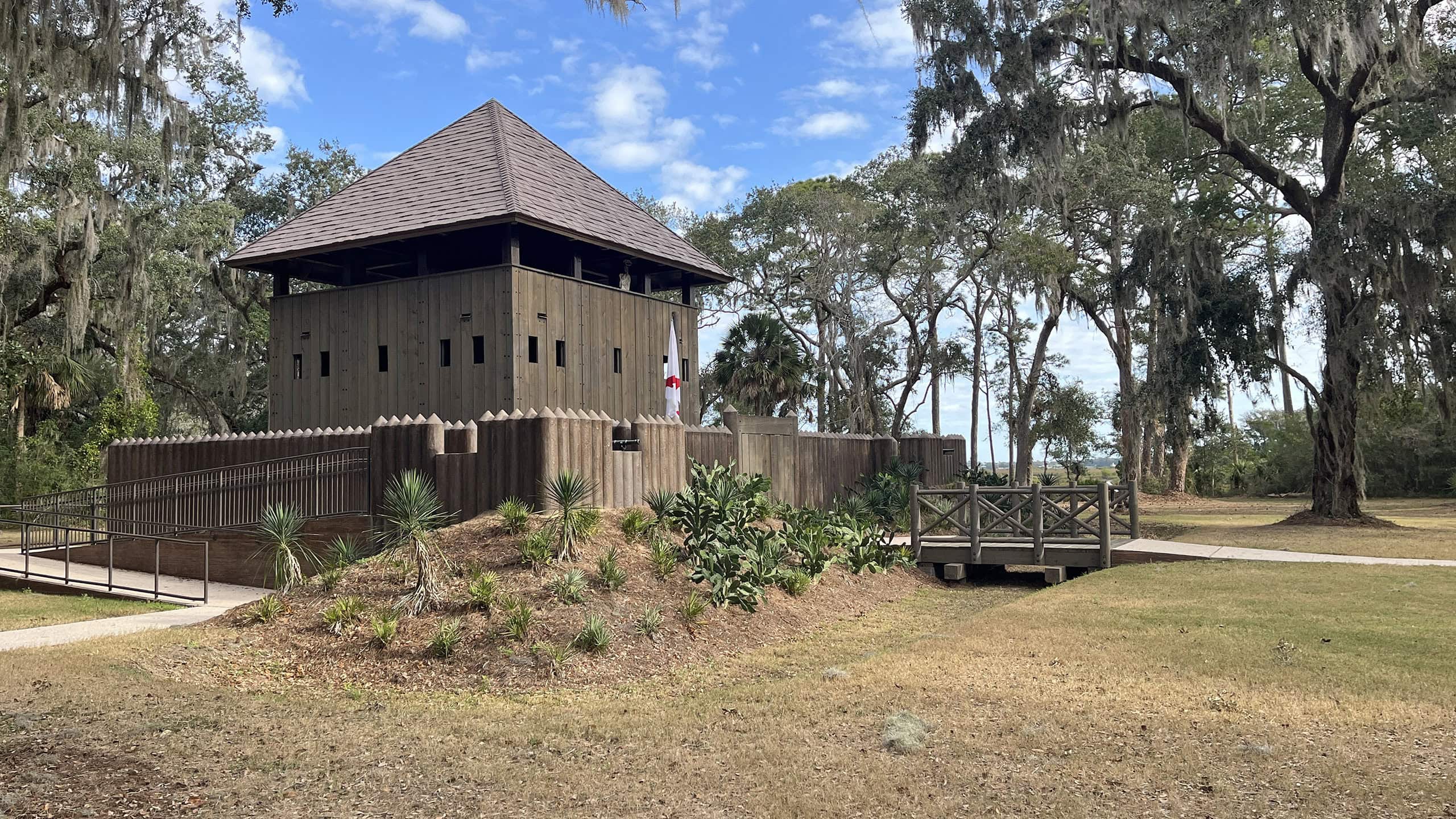 Wooden fort in a clearing amid old oaks
