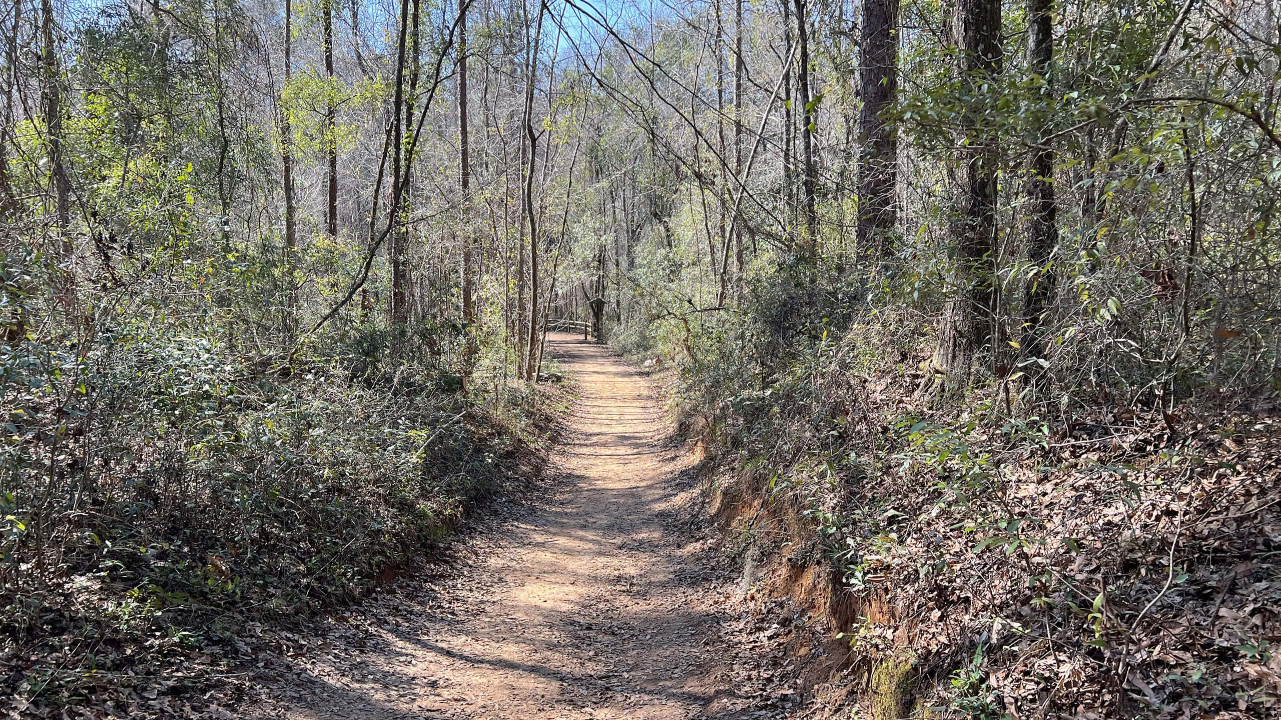 Clay path descending towards a kiosk